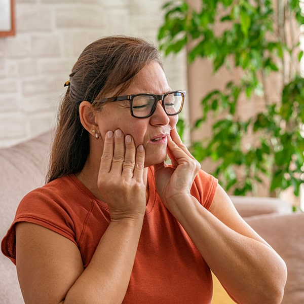 person experiencing dental pain